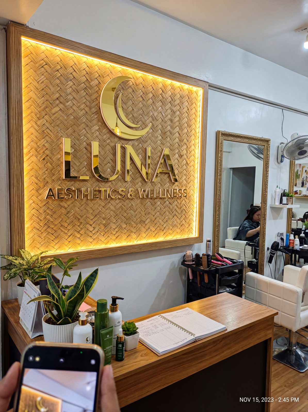 Luna — brushed gold on wood slats